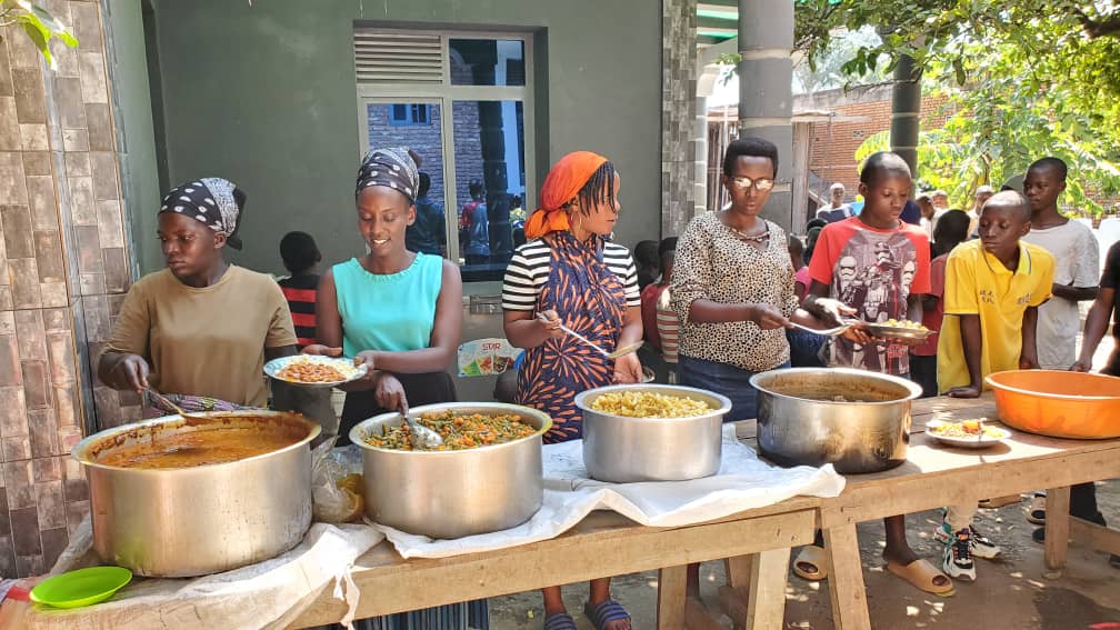 Volunteer hugging a child